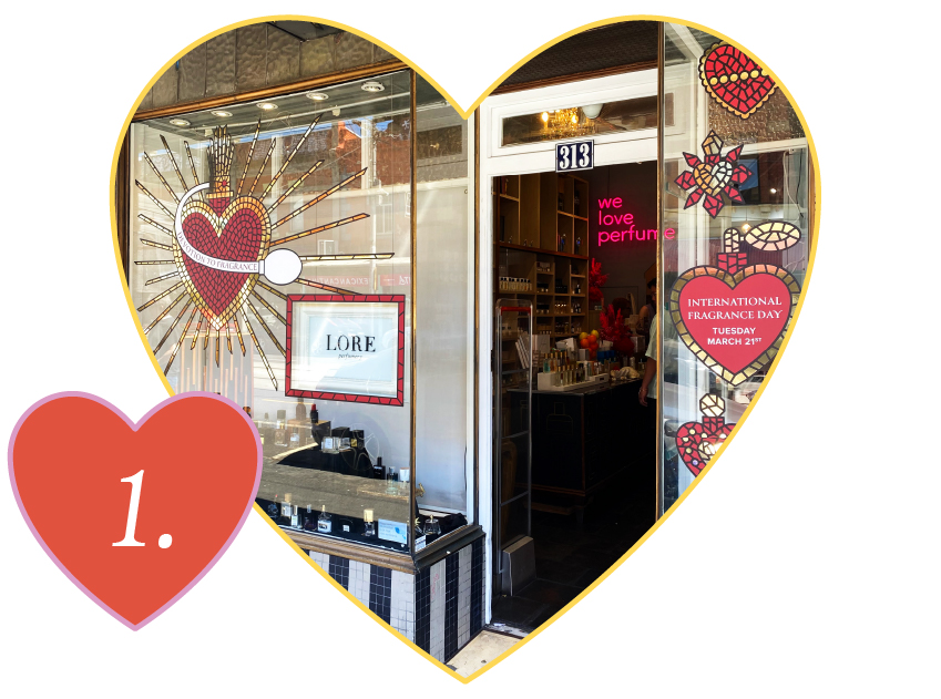 number 1 in a heart with a photo of lore perfumery store in a heart